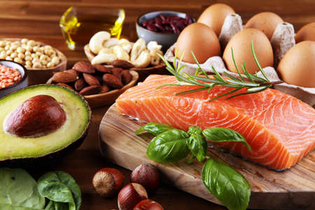 Selection of healthy food for heart, life concept with eggs and avocado on tableの写真素材