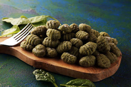 hand made gnocchi with fresh Spinach. italian traditional gnocchi on tableの写真素材