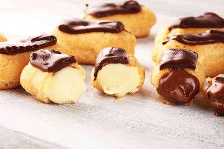 Traditional French dessert. Eclair with chocolate icing. Pastery sweet conceptの写真素材