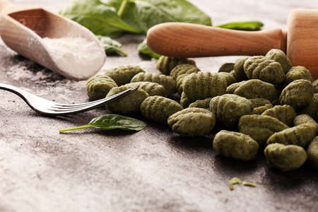 hand made gnocchi with fresh Spinach. italian traditional gnocchi on tableの写真素材