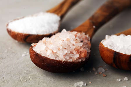 Sea salt and himalayan salt. Crystals of salt on rustic tableの写真素材