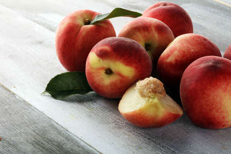 A group of ripe peaches on table. Fresh peach conceptの写真素材