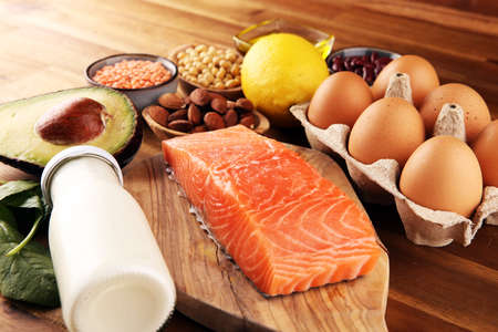 Selection of healthy food for heart, life concept with eggs and avocado on tableの写真素材