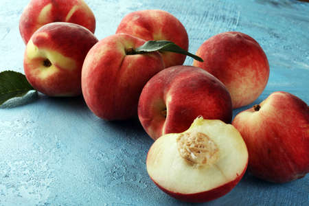 A group of ripe peaches on table. Fresh peach conceptの写真素材