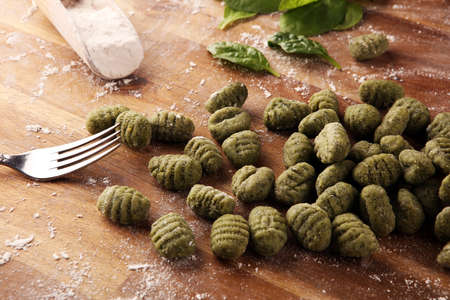 hand made gnocchi with fresh Spinach. italian traditional gnocchi on tableの写真素材