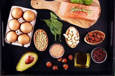 Selection of healthy food for heart, life concept with eggs and avocado on tableの写真素材