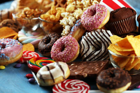Unhealthy products. food bad for figure, skin, heart and teeth. Assortment of fast carbohydrates food with fries and colaの写真素材