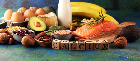 Best Calcium Rich Foods Sources. Healthy eating. Foods rich in calcium such as bean, almonds, hazelnuts, spinach leaves, cheese, and milkの写真素材