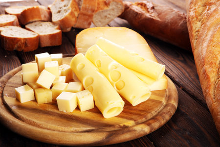 Different sorts of cheese. Cheese platter with different cheese and spices