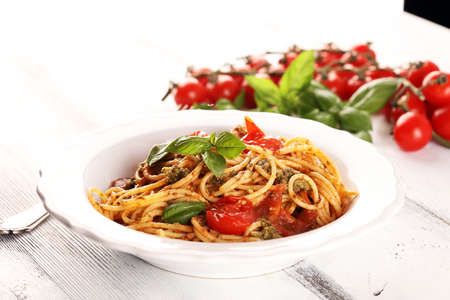 Plate of delicious spaghetti Bolognaise or Bolognese with savory minced beef and tomato sauce garnished with parmesan cheeseの写真素材
