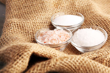Sea salt and himalayan salt. Crystals of salt on rustic tableの写真素材
