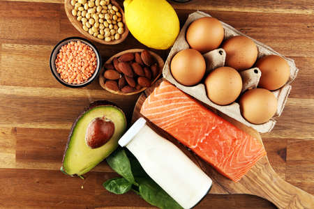 Selection of healthy food for heart, life concept with eggs and avocado on tableの写真素材