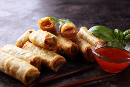 Fried chinese spring rolls with sweet chili sauce on backgroundの写真素材