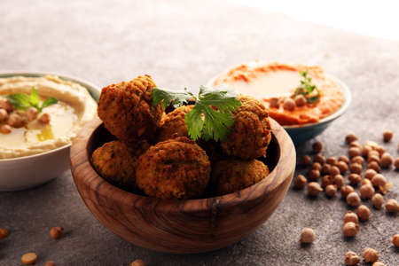 Traditional homemade hummus, falafel and chickpea on background. Jewish Cuisine.の写真素材
