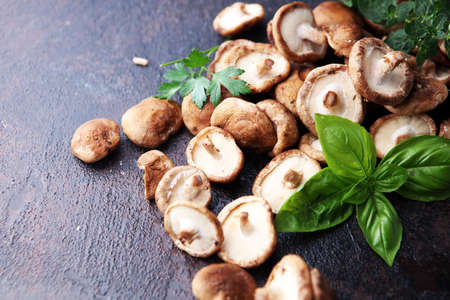 Raw wild shiitake mushroom. Composition with wild mushrooms on tableの写真素材
