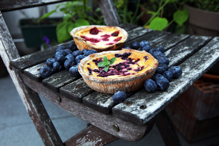 Blueberry pie or homemade cheesecake with blueberries. Delicous dessert blueberry tart on rustic...
