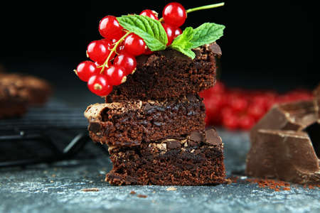 Brownie stack, chocolate cake on rustic wooden board on tableの写真素材