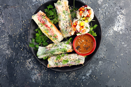 Fried chinese spring rolls with sweet chili sauce on backgroundの写真素材