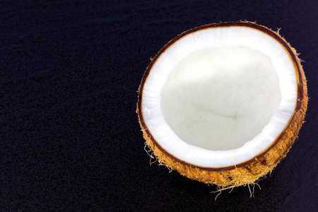 close up of a coconut on a wooden background