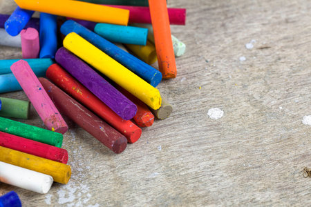 multicolored oil pastels on artist wooden workplaceの写真素材
