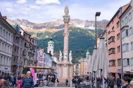 View of tourists gathering at our lady statue or St Anne Column (Annasaule) which is a statue of the Virgin Mary in Maria-Theresien Street. Taken in Innsbruck, Austria on October 15 2016のeditorial素材