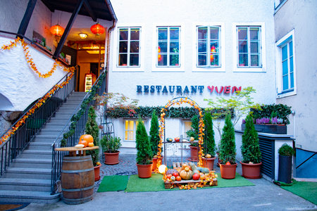 Beautiful decoration of autumn holiday by Yuen Restaurant facade. The Yuen China Restaurant was the first asian restaurant in Salzburg. Taken in Salzburg, Austria, October 20, 2016のeditorial素材