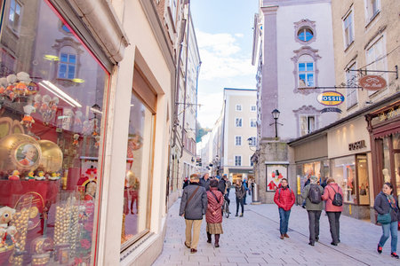 View of famous shopping street Getreidegasse which is near to Wolfgang Amadeus Mozart birthplace. Taken in Salzburg, Austria, October 20, 2016のeditorial素材