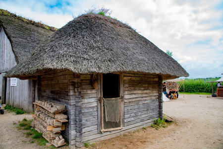 Reconstructed Viking thatched house on the basis of archaeological finds in Viking Haithabu village. Taken in Busdorf, Germany on July 15, 2016のeditorial素材