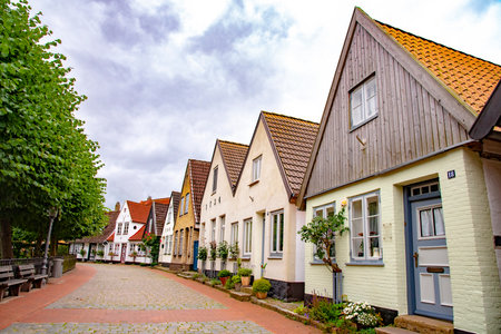 Beautiful row of old houses in Holm, which is an old fishing village, founded around 1000 a.c. at the Schlei, formerly an island now connected to the town of Schleswig. There are picturesque houses and cobbled roads. Taken on July 15,2016のeditorial素材