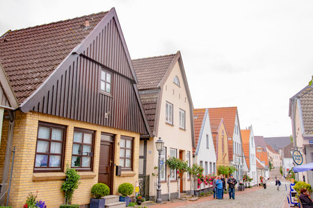 Beautiful row of old houses in Holm, which is an old fishing village, founded around 1000 a.c. at the Schlei, formerly an island now connected to the town of Schleswig. There are picturesque houses and cobbled roads. Taken on July 15,2016のeditorial素材