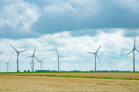 Wind turbines for electric power production in Schleswig-Holstein, Germanyの写真素材