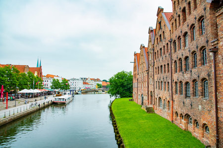The Salzspeicher which is a row of riverside salt warehouses brick-built in the Renaissance style between 1579 and 1745. Taken in Lubeck, Germany on July 16, 2016のeditorial素材