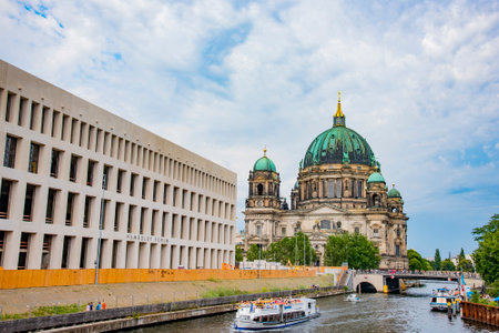 Boat tour on Spree river with the background of Berliner Dom and public library building in Berlin, Germany on July 21, 2016のeditorial素材