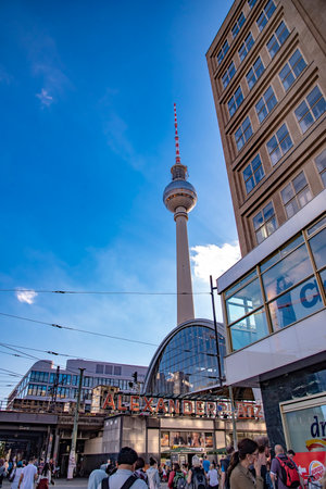 People walking at Alexanderplatz which is a large public square and transport hub in the central Mitte district of Berlin. Taken in Berlin, Germany on July 20, 2016のeditorial素材