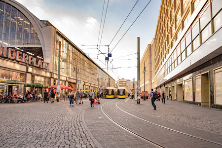 People walking at Alexanderplatz which is a large public square and transport hub in the central Mitte district of Berlin. Taken in Berlin, Germany on July 20, 2016のeditorial素材