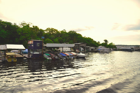 Fishing boats parking at Marina Do Davi along Taruma Acu River at sunset. Taken in Manaus, Brasil on May, 31, 2019のeditorial素材