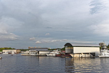 Fishing boats parking at Marina Do Davi along Taruma Acu River at sunset. Taken in Manaus, Brasil on...