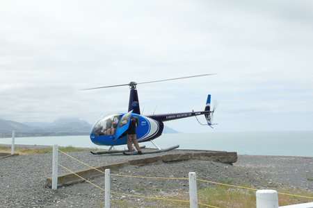 Robinson`s R44 Raven Series Helicopter taking tourists to whale watching in Kaikoura New Zealand on Dec 9, 2010のeditorial素材