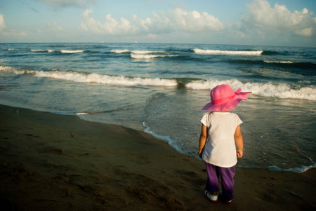 Pretty little girl on the beach near sea, summer, vacation, travel - conceptの写真素材