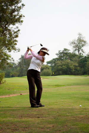 A woman Golf Player hits her ball on the fairway during practice on the golf course of Tolly golf field, Indiaのeditorial素材