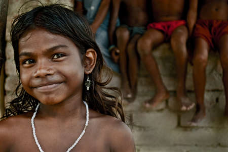 A group of Indian rural children are playing on a village compound for fun.のeditorial素材