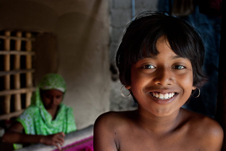 Micro Finance: Two rural Indian women are busy with making hand-knighted garments at outskirts of...
