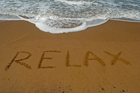 Relax on sandy beach 1: Relax written on sandy beach near sea. Beach travel concept. Summer holiday.Outdoor.の写真素材