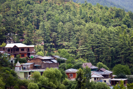 Tourist huts and local houses are in the slope of mountains at the tourist destination Shimla in...