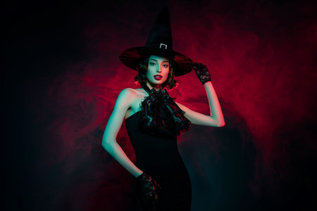 Photo of adorable sexy mysterious woman wear gothic witch dress hand arm headwear isolated red fog...
