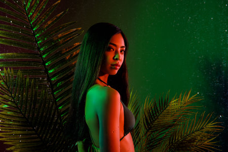 Profile side portrait of alluring girl wear swimsuit resting bali indonesia isolated over bright green color backgroundの写真素材