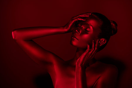 Photo of stunning abstract lady sculpture hands touch enjoy her skin eyes closed isolated on maroon...