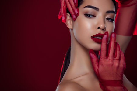 Close up photo of charming chic lady wearing red gloves look attractive empty space isolated burgundy color backgroundの写真素材