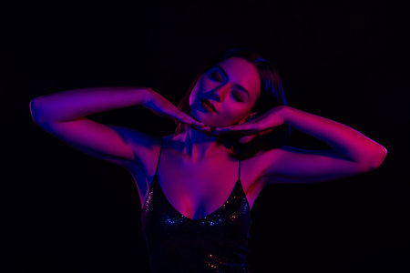 Tender beauty appearance lady hold her arms under chin closed eyes dancing passionately over...