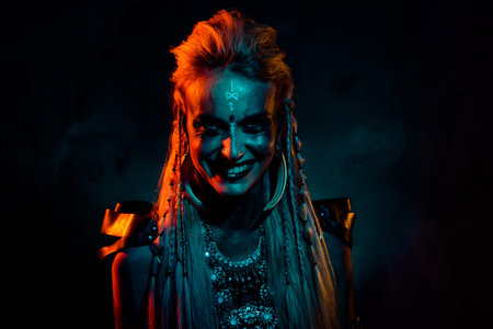 Photo of crazy mad mystic woman wear gothic valkyrie costume laughing isolated orange color...